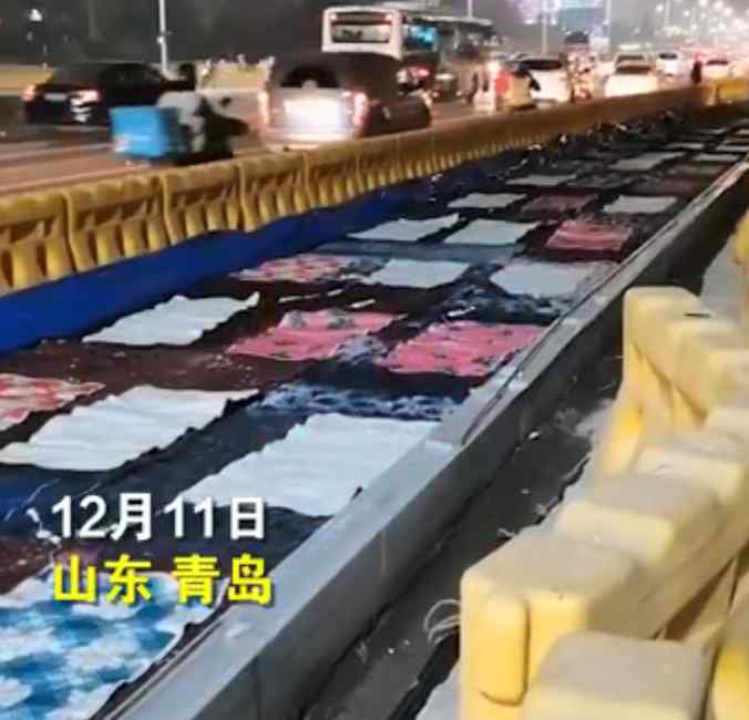 官方回应青岛路面铺满电热毯：为了保证冬季施工的混凝土质量