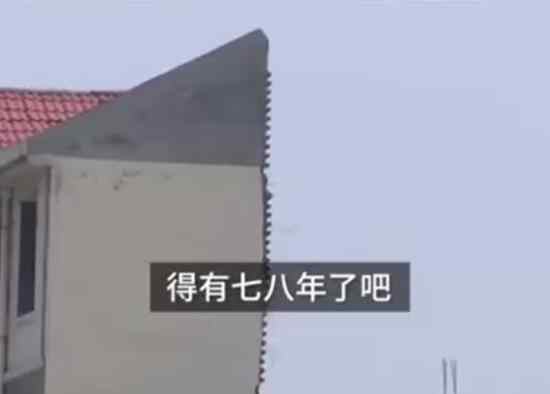 河南一楼房三四楼仅盖一面墙 这是为什么