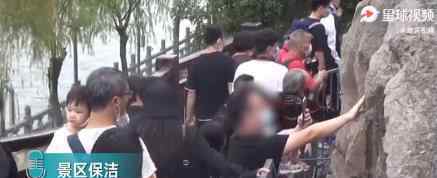 洛阳龙门石窟佛像被游客摸出包浆 请文明旅游