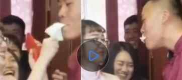 迎亲队新房内玩嘴接纸巾的游戏 伴郎一个举动让伴娘不知所措究竟是怎么回事？